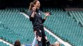 kate-middleton-is-lifted-into-the-air-while-playing-down-&-dirty-rugby-in-london-—-photos
