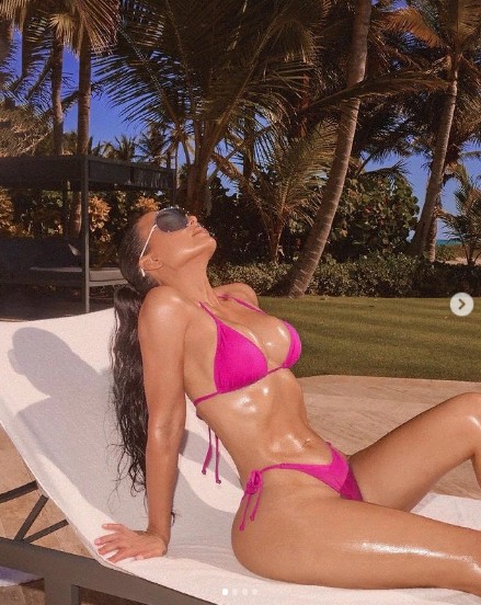 Kim Kardashian Catches Rays In Hot Pink Bikini As She…